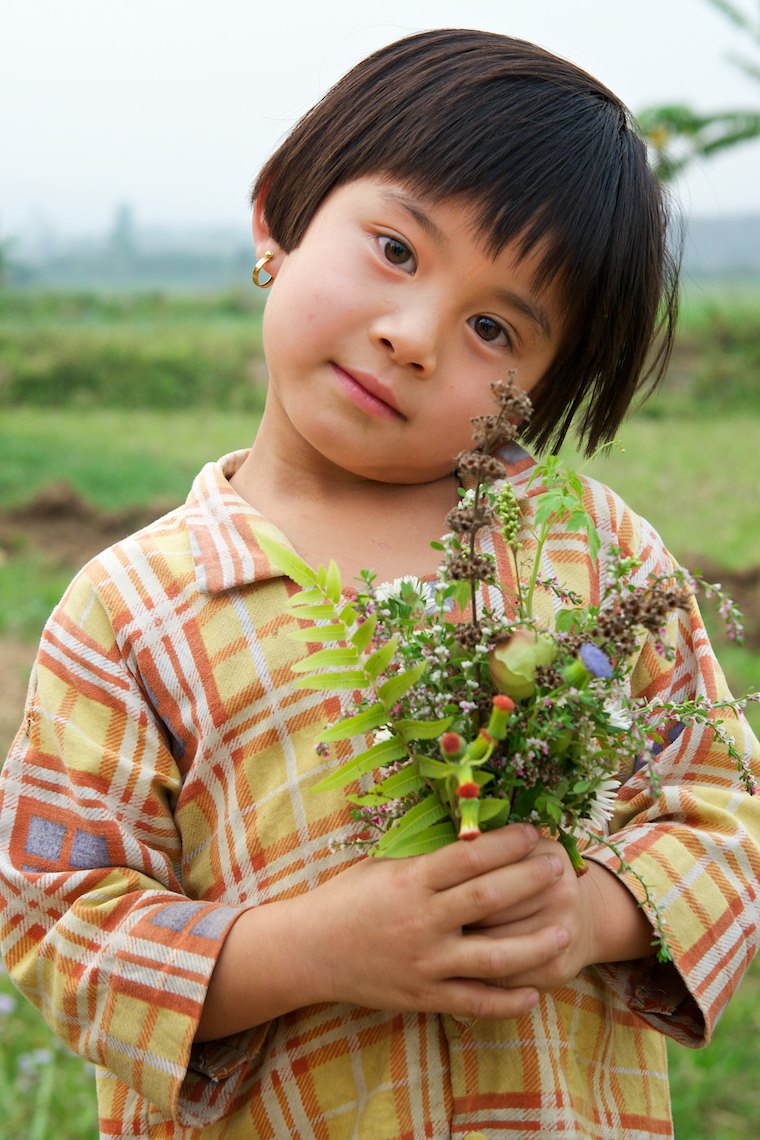 Burma Myanmar Hsipaw  young country girl with flowers