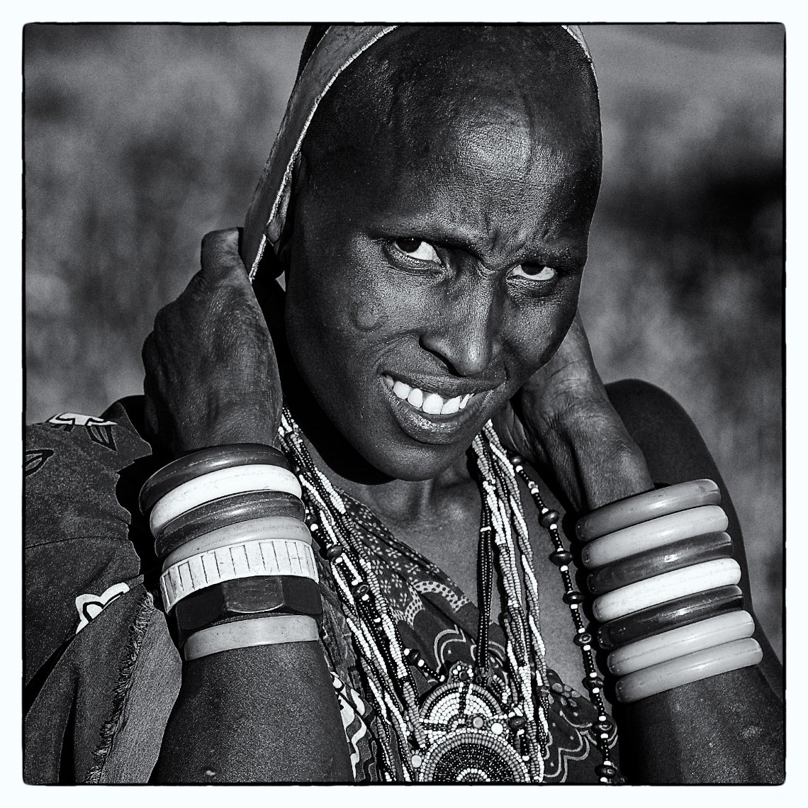 Kenya Amboseli Massai portrait woman carrying water