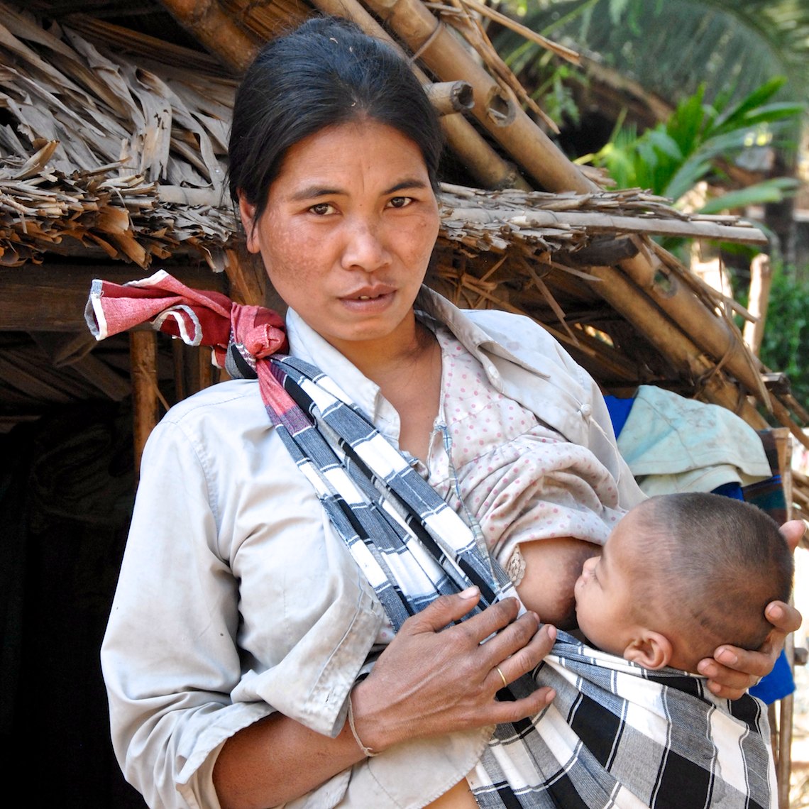 Laos portrait mother nursing child