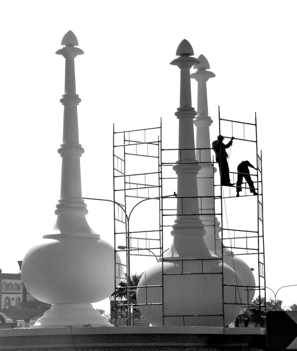 Qatar workers renovating monument